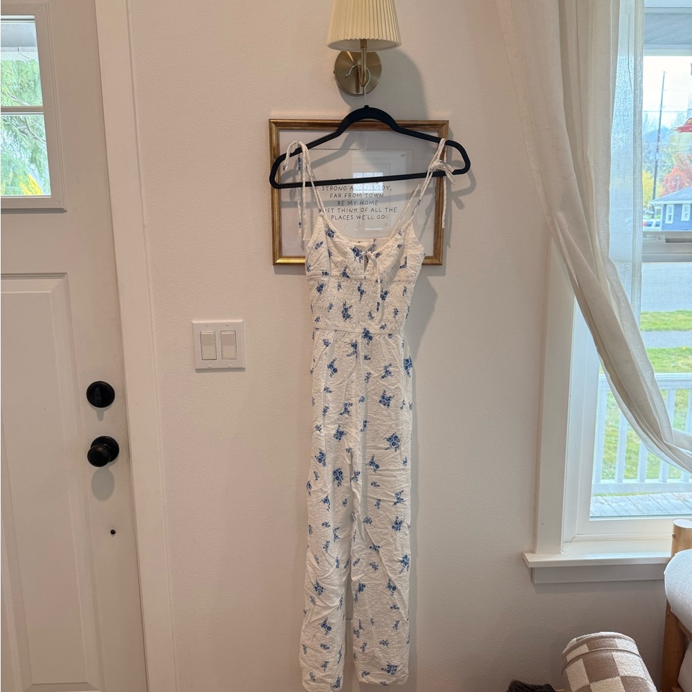 H&M White Jumpsuit with Blue Floral Print and Adjustable Straps
